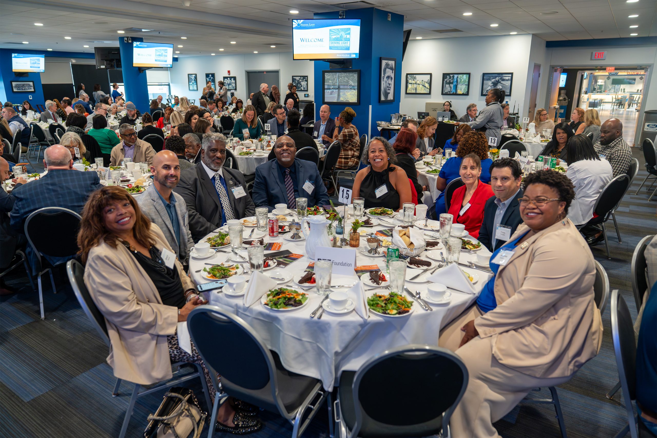 Images from the 2025 SEMCOG Shining Light Awards ceremony, showcasing honorees receiving recognition for outstanding regional cooperation and leadership. The photos feature award recipients posing with plaques, speakers addressing the audience, and attendees gathered in a formal event setting with branded banners and sponsor logos in the background.
