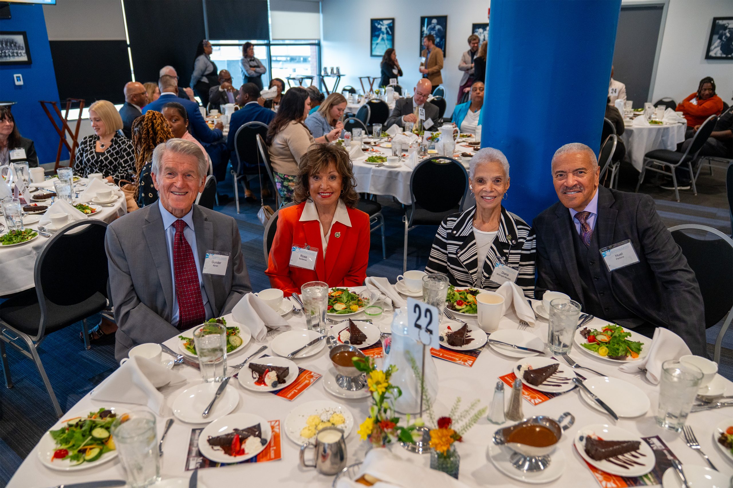 Elegant award ceremony dinner at the Shining Light Awards event, featuring diverse guests enjoying a professionally catered meal, highlighting community recognition and celebration.