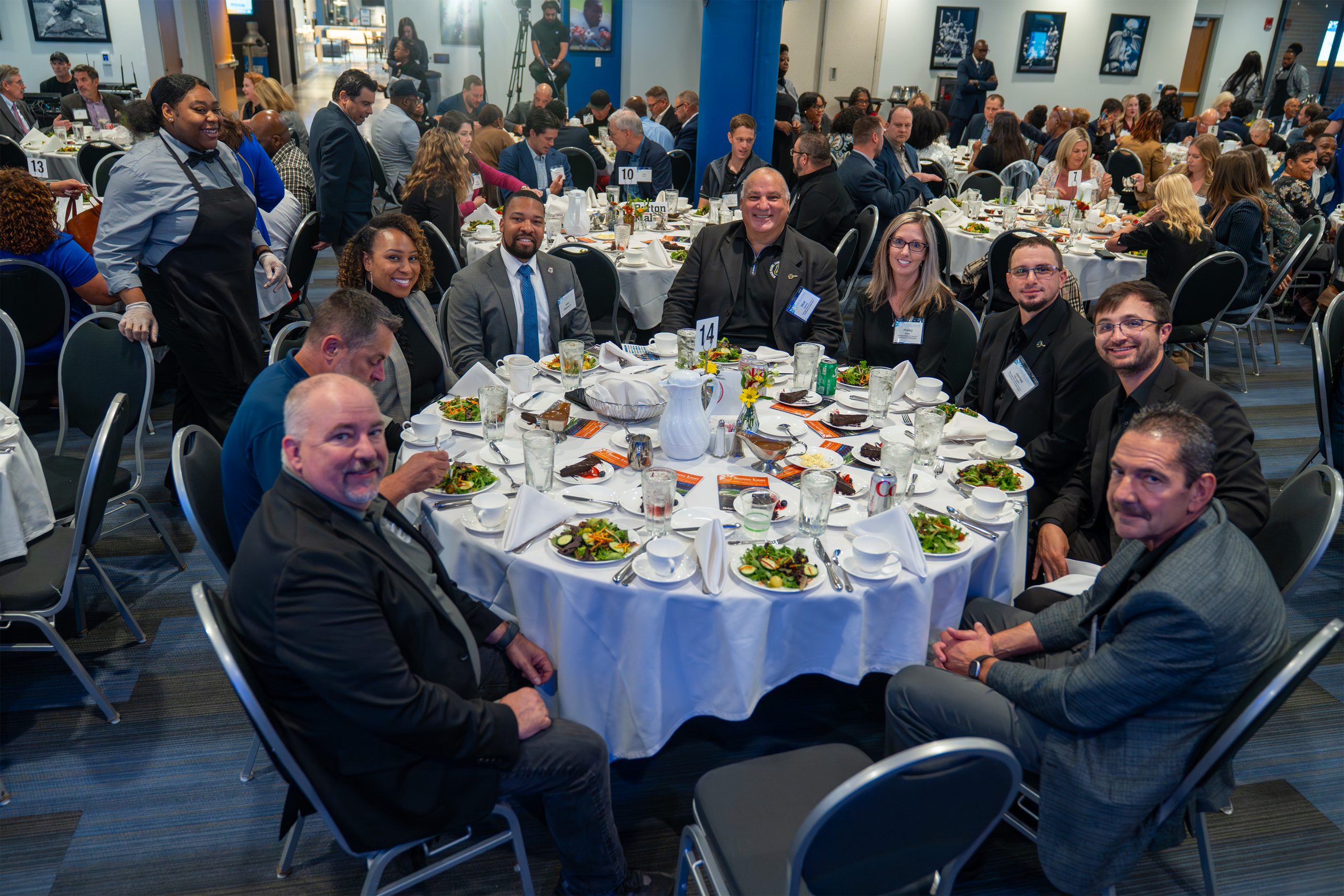 Elegant event at the Shining Light Awards with attendees enjoying a formal dinner, showcasing diversity and celebration in a professional setting.