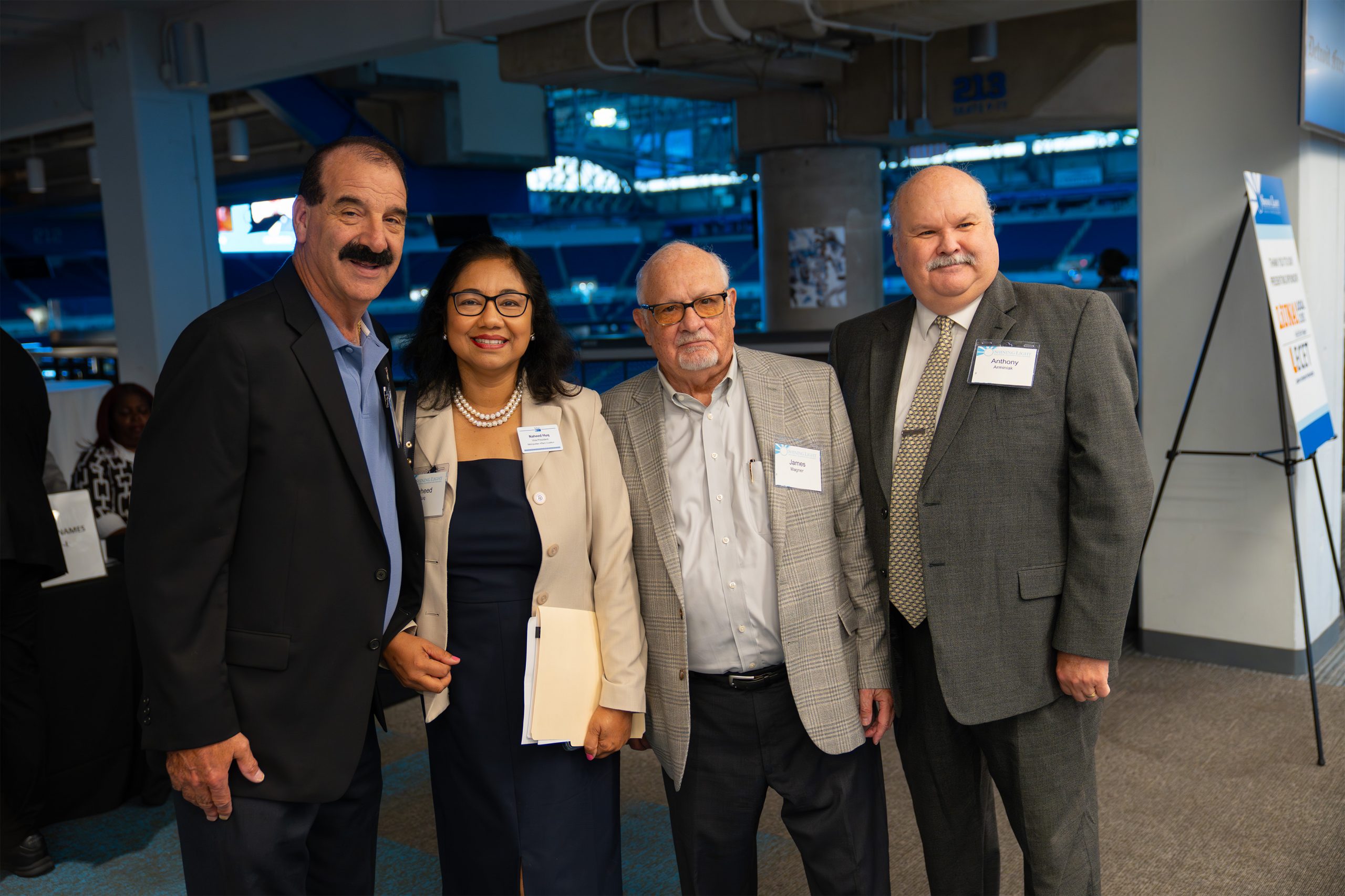 Innovative professionals at the Shining Light Awards event, showcasing leadership and community impact in a corporate or conference setting.