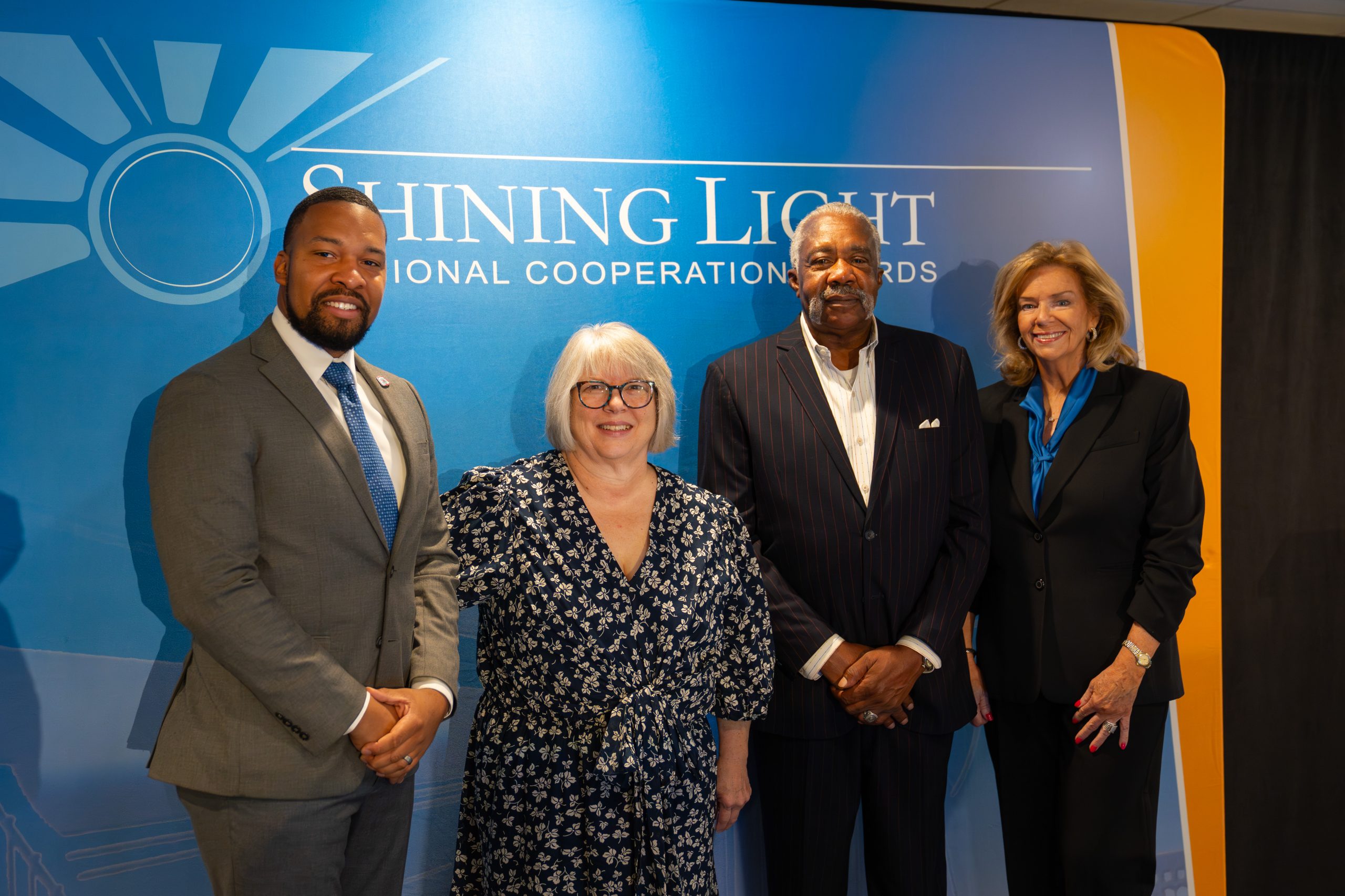 Diverse group of professionals at Shining Light International Cooperation Awards ceremony, highlighting collaboration and leadership in global initiatives for SEO relevance.